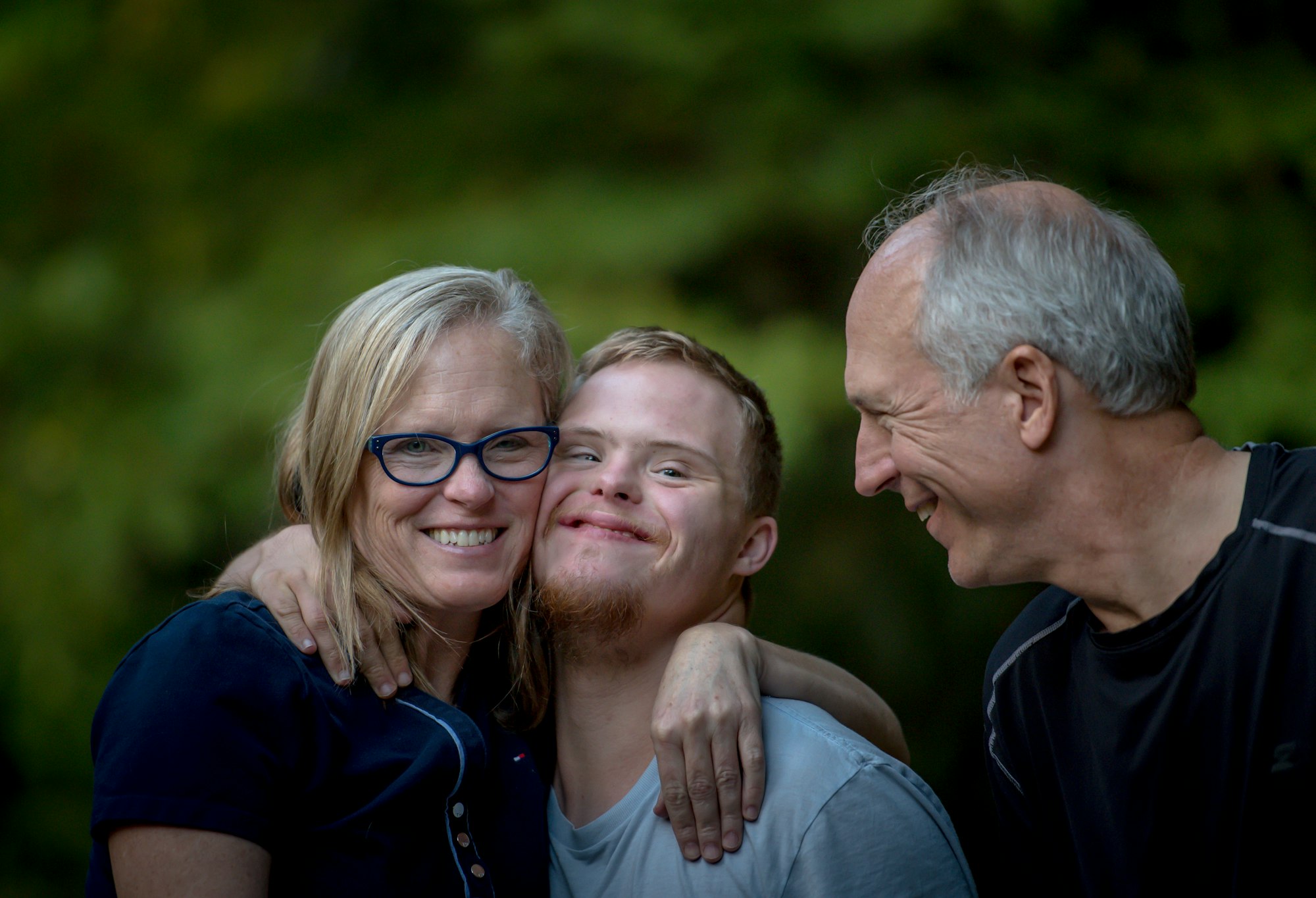 Family embracing outdoors