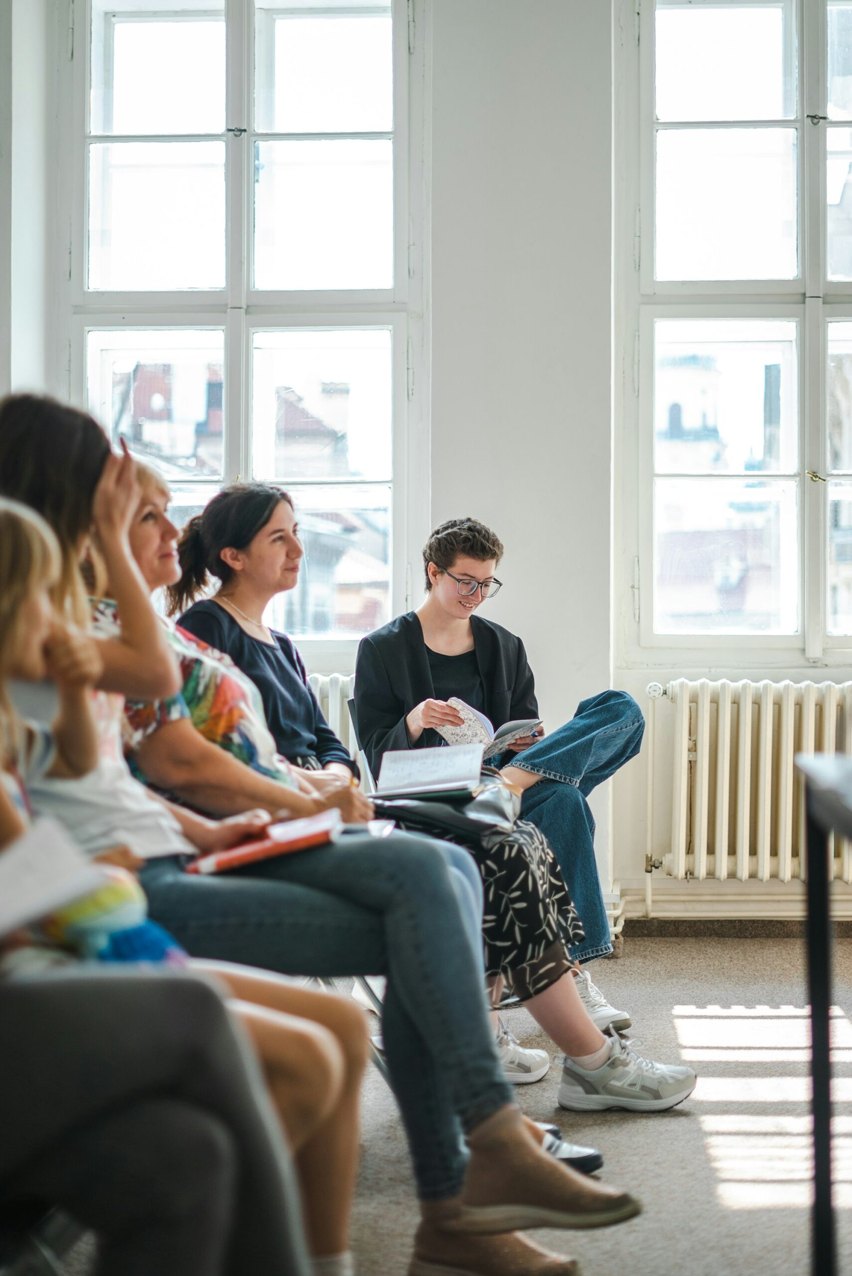 Support group sitting together in a room
